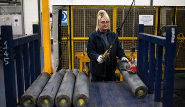 An employee manoeuvres 155mm artillery shell casings during their manufacturing process at the BAE Systems factory in Washington, near Newcastle upon Tyne in north-east England on November 8, 2023