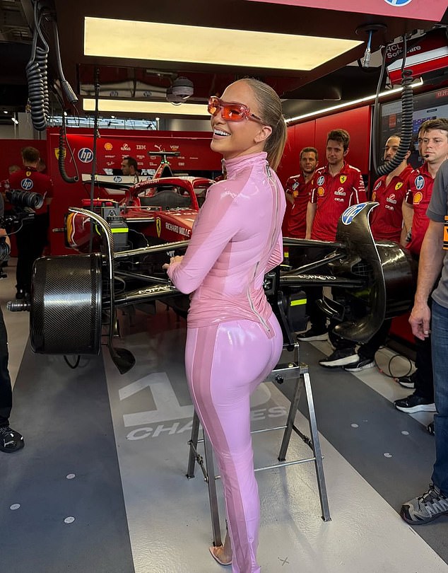 The music and movie superstar was all smiles in her skintight pink bodysuit at the event