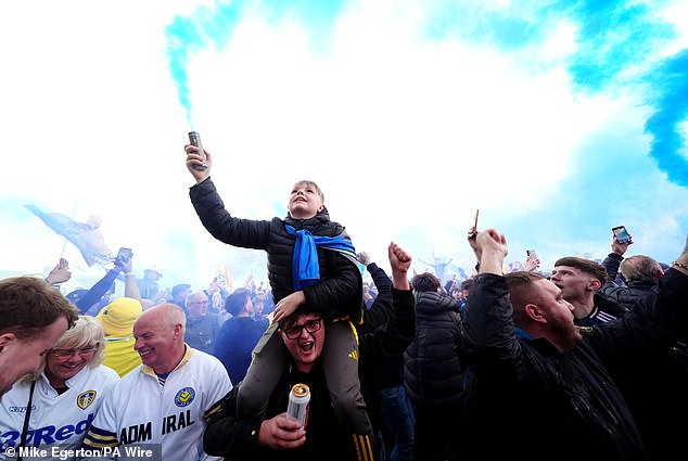 Leeds supporters arrived in their numbers outside Elland Road with flares and smiles aplenty