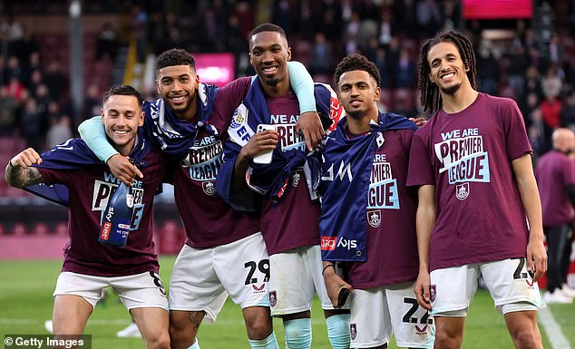 Hannibal Mejbri (right) enjoys the moment as the Clarets celebrate their return to the top flight