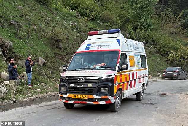 An ambulance drives following a suspected militant attack, near Pahalgam in south Kashmir's Anantnag district