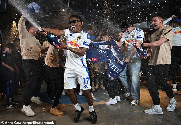 Largie Ramazani was in the thick of the celebrations after Leeds' promotion was confirmed