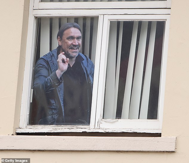 A cut-out of the highly venerated Leeds boss is spotted in the window of a supporter's house