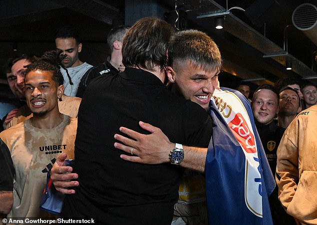 Farke embraced Piroe as the players and manager were drenched in champagne on Monday