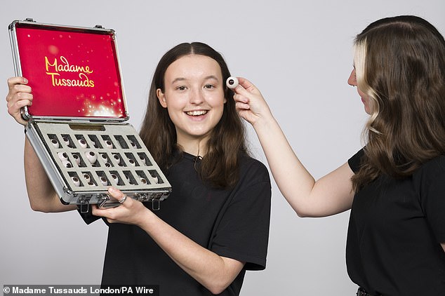 Bella flashed their gorgeous smile as they held up a box of eye balls while trying to find the perfect colour to match