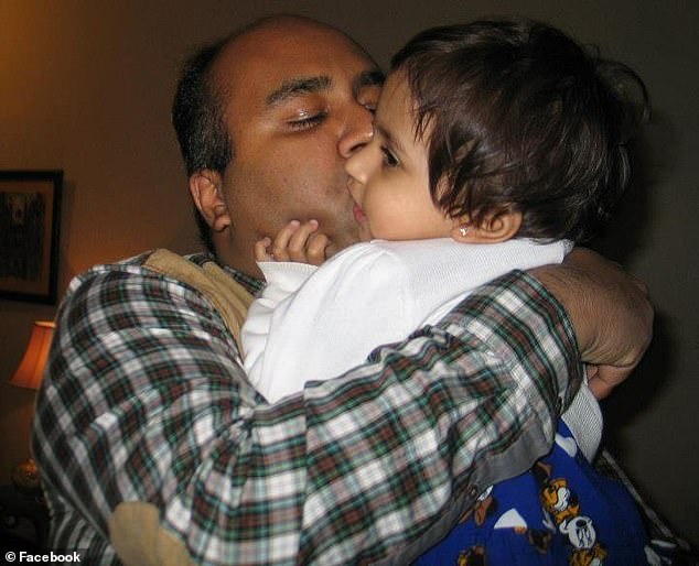 Mirza with one of his young children whom he would never make it home to