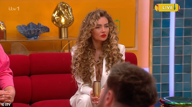 Minutes later it was revealed that Ella, who looked sensational as she went braless under a plunging white blazer, had been evicted as she was greeted by cheers by the audience