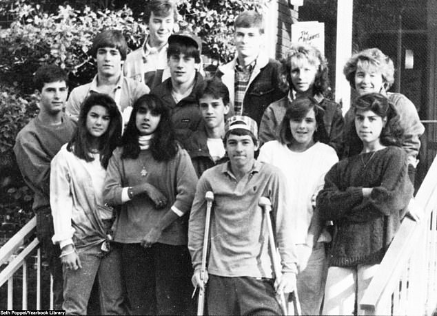Hamm left the school and pursued a career in acting. He is shown, center, wearing a puffer jacket and baseball hat