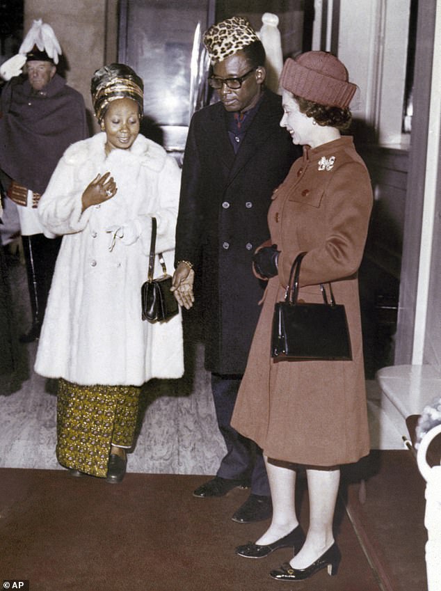 Queen Elizabeth II with President Mobutu of Zaire and his wife Marie-Antoinette. The Queen became very angry with the couple after they smuggled a dog into Buckingham Palace