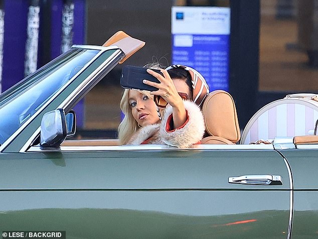Wearing a fur-trimmed jacket, Alexa leaned out the window to snap a selfie of the pair¿though it¿s unclear whether the moment was scripted or just behind-the-scenes fun