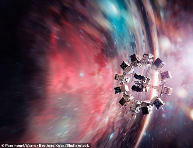 Like falling into a black hole as imagined by Interstellar (pictured), a wormhole's intense gravity could allow you to travel billions of light years across the universe in seconds or even travel through time