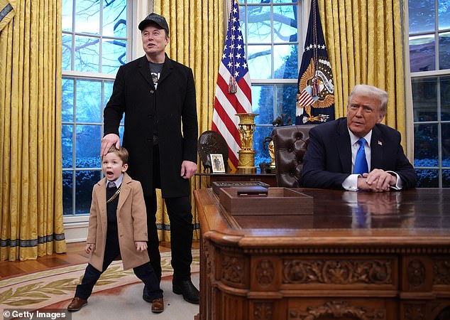 Musk, joined by his son X, delivers remarks alongside President Trump during an executive order signing in the Oval Office at the White House on February 11
