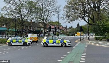 Three people have been left injured amid reports of a man spotted 'armed with a crossbow' in a major city today (Pictured: Police at the scene in Leeds today)