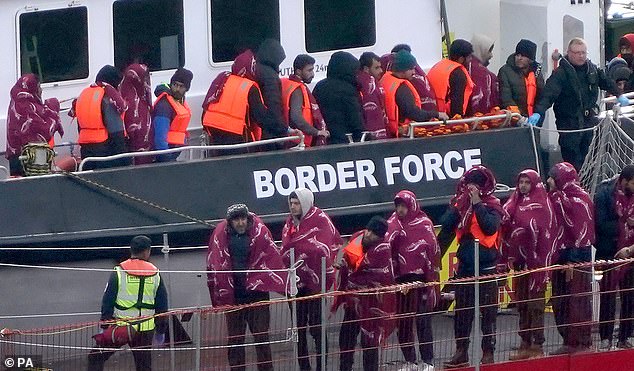 Staggeringly, an estimated 1.2 million illegal immigrants now live here. The true number may be even greater. Pictured: A group of people thought to be migrants are brought in to Dover, Kent, in October 2023