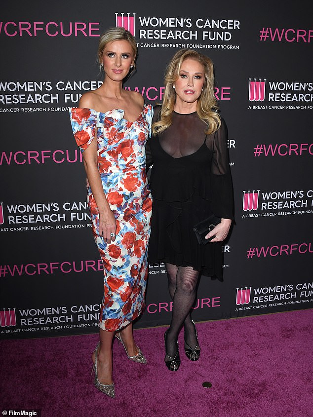 Her daughter Nicky Hilton eschewed her all-black look in favor of a red, white and blue floral dress