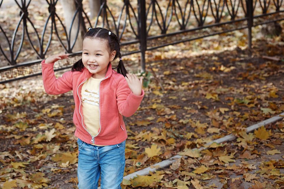 3-4 years girl stimming in autumn park