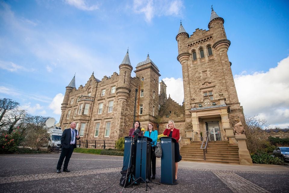 Chris McNabb (left) with Finance Minister Caoimhe Archibald, First Minister Michelle O'Neill and Deputy First Minister Emma Little-Pengelly.