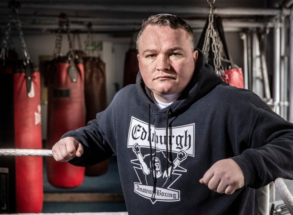 Portrait of Bradley Welsh, wearing an Edinburgh Amateur Boxing hoodie.