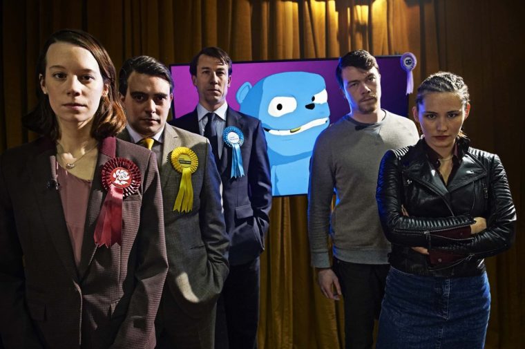 Television Programme: Black Mirror. The Waldo Moment l-r: Gwendolyn (Chloe Pirrie), Simon Finch (Louis Waymouth), Liam Monroe (Tobias Menzies), Jamie (Daniel Rigby) and Tamsin (Christina Chong).