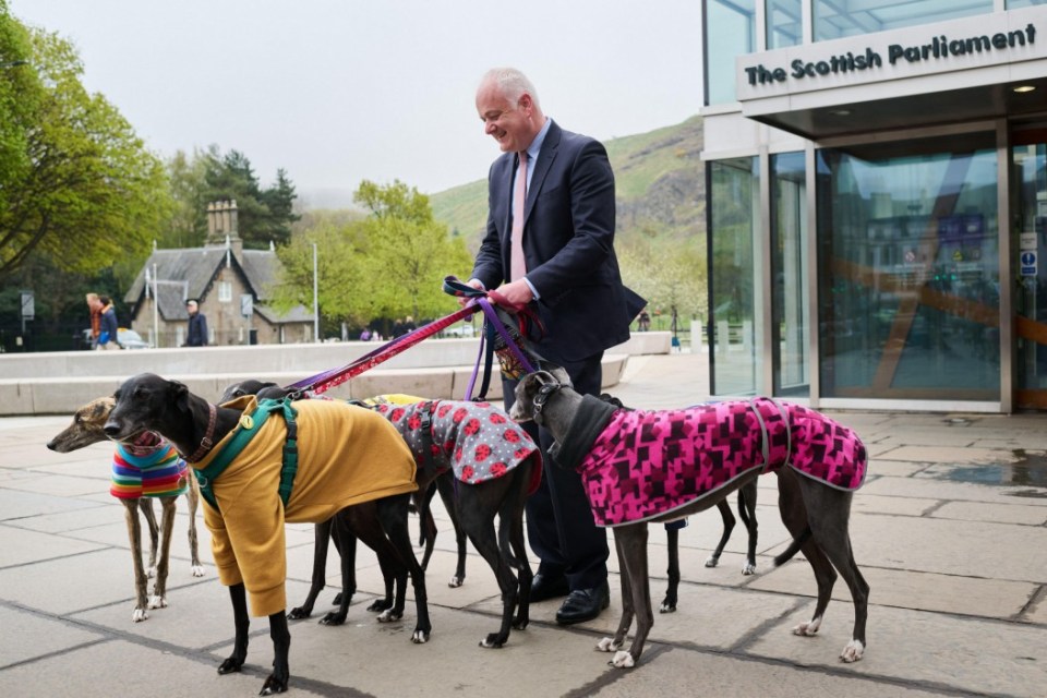 Alamy Live News. 3AYRMW3 Edinburgh Scotland, UK 23 April 2025. Scottish Green MSP Mark Ruskell with Unbound the Greyhound Coalition and other campaigners outside the Scottish Parliament holding a photocall to mark the introduction of his bill to End Greyhound Racing in Scotland. credit sst/alamy live news This is an Alamy Live News image and may not be part of your current Alamy deal . If you are unsure, please contact our sales team to check.
