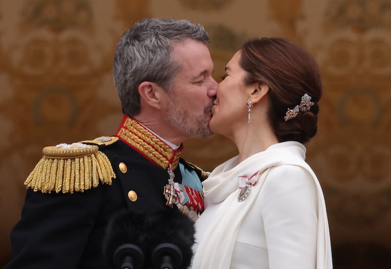 Danish King Frederik X and Queen Mary kiss on the balcony of Christiansborg Palace shortly after his proclamation on January 14, 2024 in Copenhagen, Denmark.
