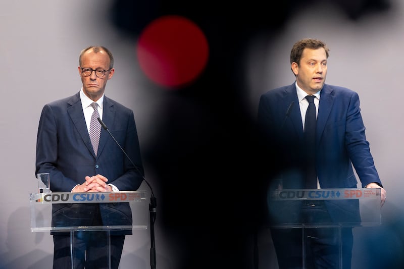 Friedrich Merz, (left), leader of the Christian Democratic Union, and Lars Klingbeil of the German Social Democrats (SPD) speak to the media during the presentation of the coalition contract earlier this month. Photograph: Maja Hitij/Getty Images