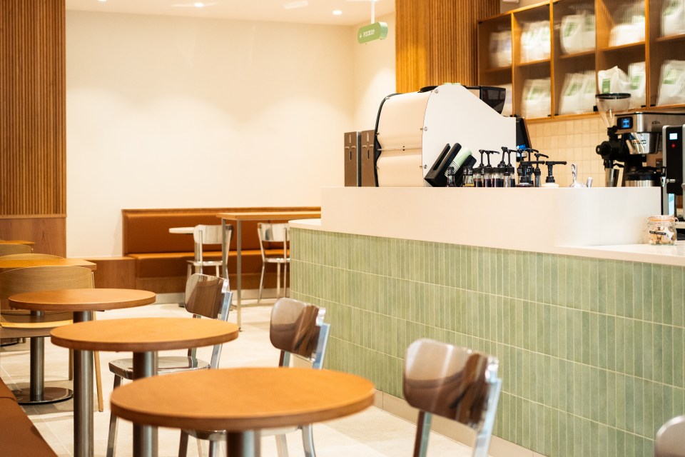 Coffee shop interior with tables and chairs.