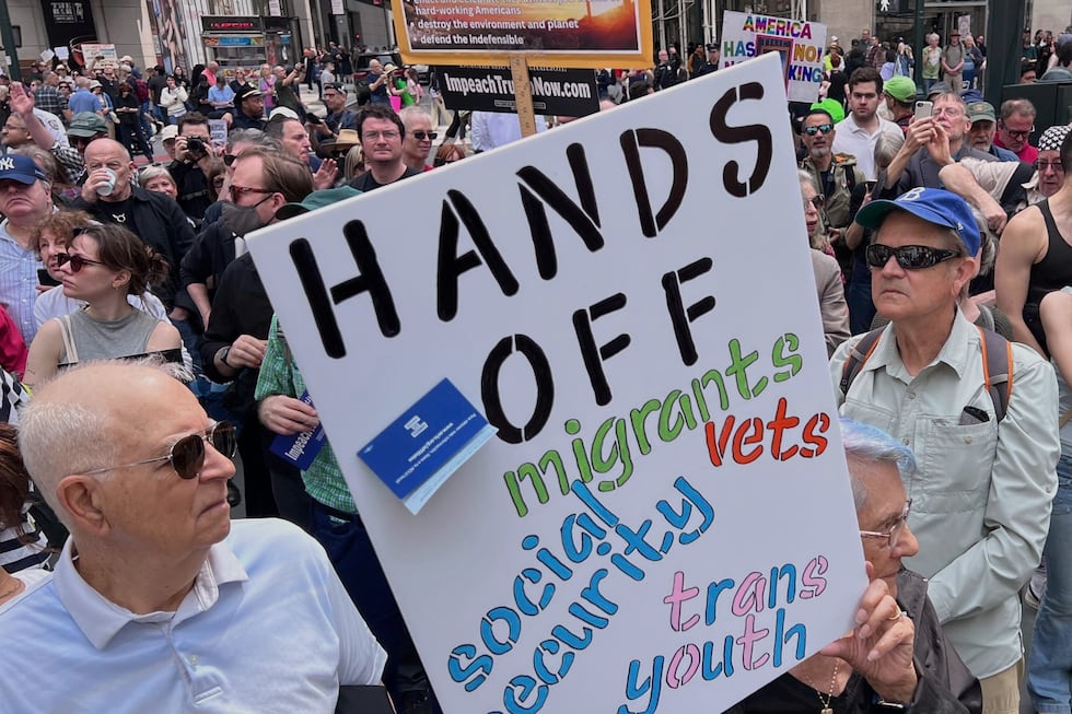 People gather to protest President Donald Trump's policies on Saturday, April 19, 2025 in New...