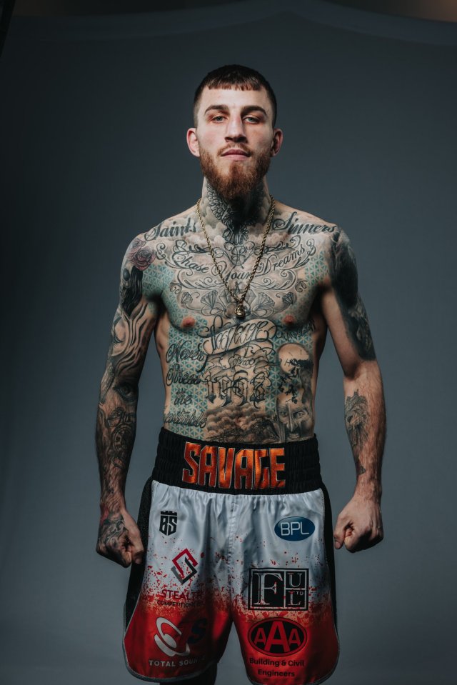 Portrait of a heavily tattooed boxer.