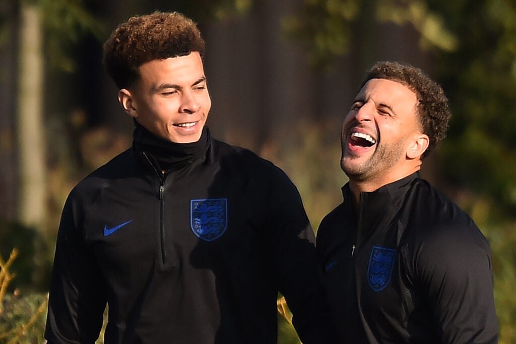 England's midfielder Dele Alli (L) and England's defender Kyle Walker attend a training session at Tottenham Hotspur's training ground in north Lon...