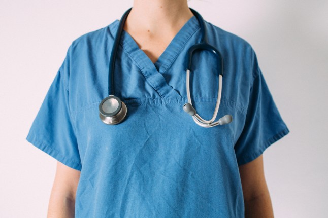 Female Doctor in blue surgical scrubs with Stethoscope