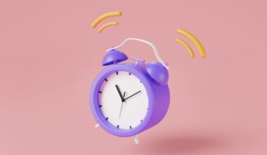 Ringing purple alarm clock on pink background. For deep due diligence, minimize disruption to maximize success.