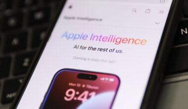 A laptop keyboard and Apple Intelligence on website displayed on a phone screen