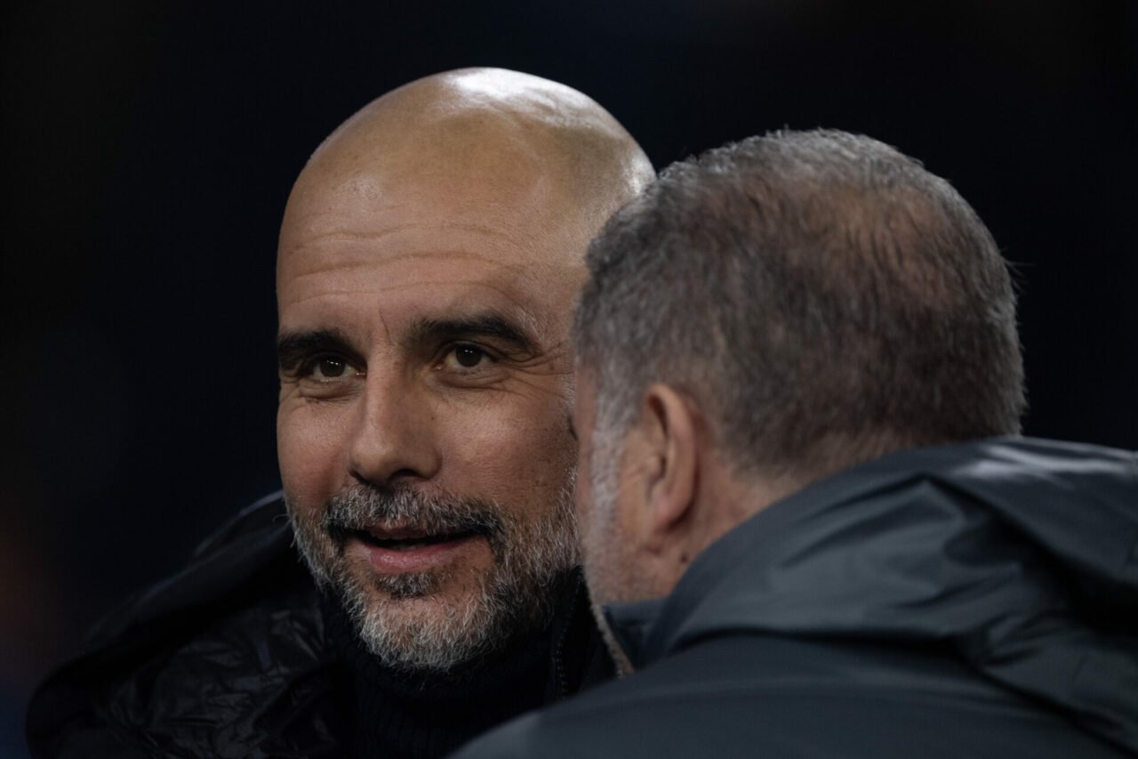 Pep Guardiola, Manager of Manchester City, embraces Ange Postecoglou, Manager of Tottenham Hotspur, prior to the Premier League match between Manch...