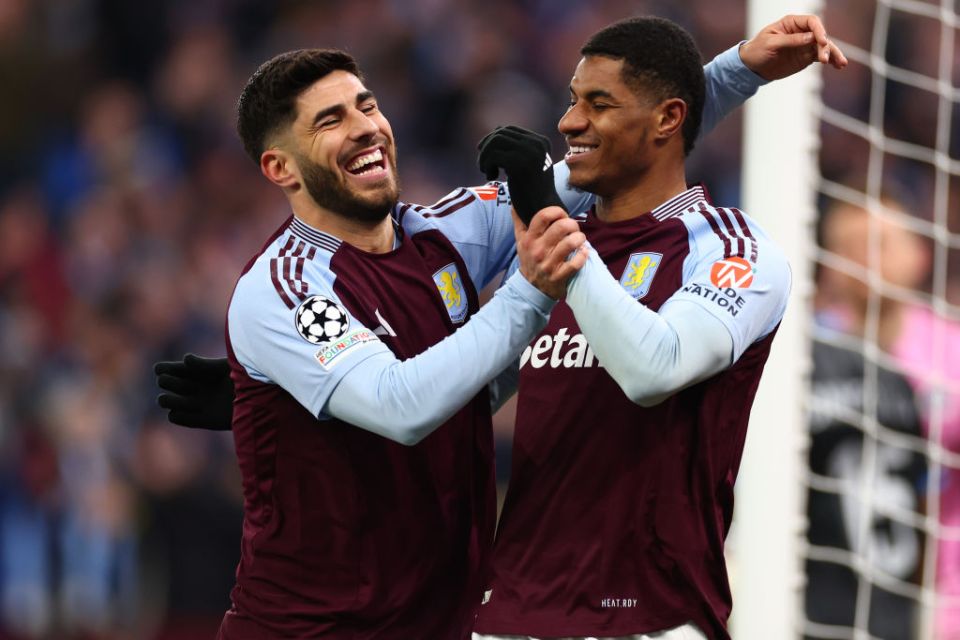 BIRMINGHAM, ENGLAND - MARCH 12: Marco Asensio of Aston Villa celebrates with Marcus Rashford after he scored for 3-0 during the UEFA Champions League 2024/25 UEFA Champions League 2024/25 Round of 16 Second Leg match between Aston Villa FC and Club Brugge KV at Villa Park on March 12, 2025 in Birmingham, England. (Photo by Shaun Brooks - CameraSport via Getty Images)
