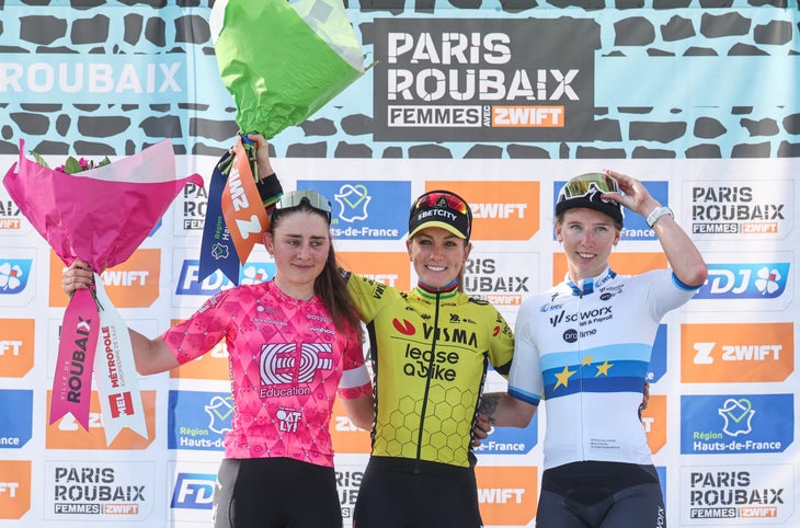 Second placed EF Education-Oatly's Italian rider Letizia Borghesi (L), First placed Team Visma-Lease a Bike's French rider Pauline Ferrand Prevot and SD Worx-Protime's Dutch rider Lorena Wiebes celebrate on the podium of the fifth edition of the Paris-Roubaix women's race, 148,5 km between Denain and Roubaix, northern France on April 12, 2025. (Photo by Francois LO PRESTI / AFP)