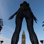 A huge sculpture of a naked woman.