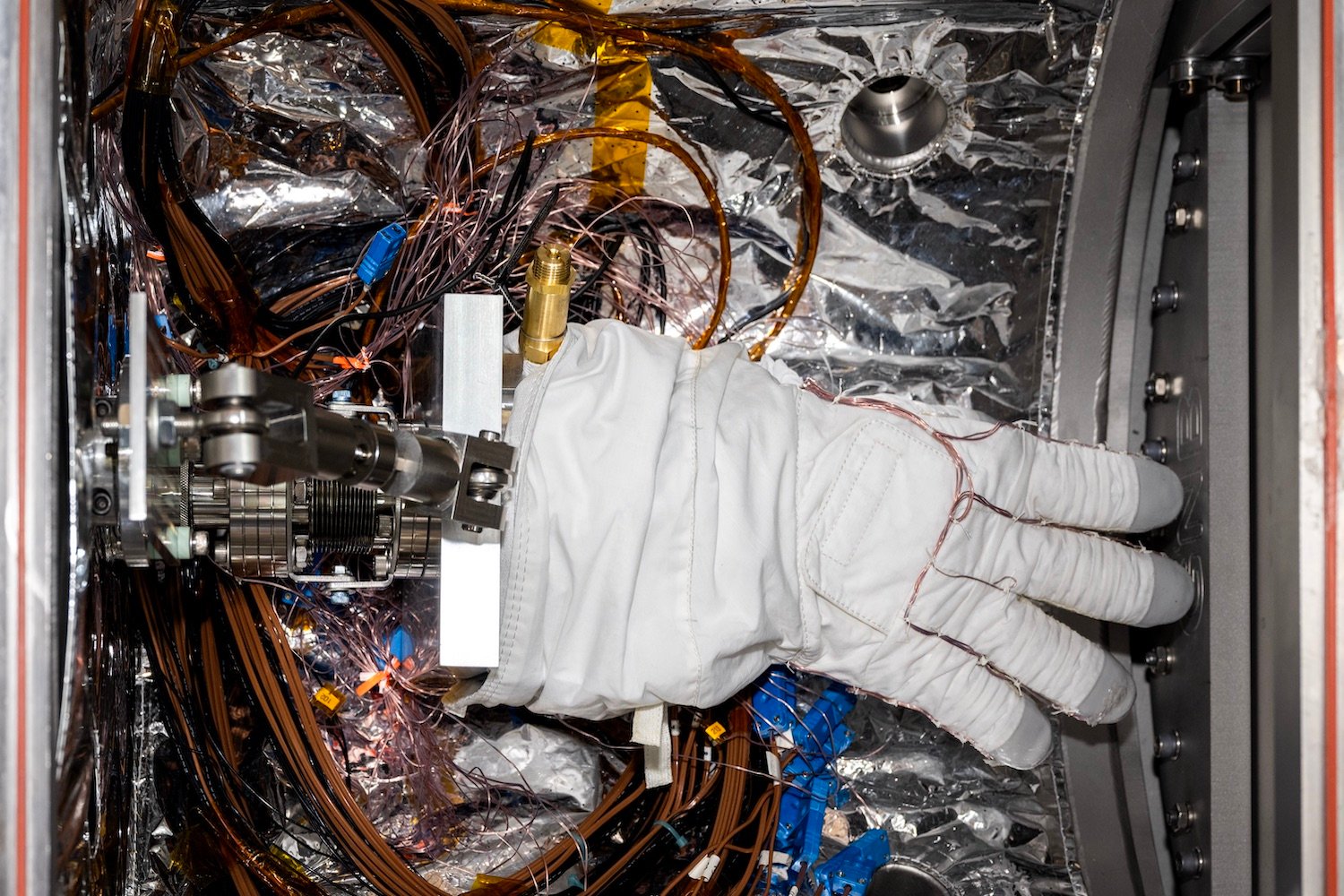 An astronaut glove being prepped for testing in the CITADEL chamber.
