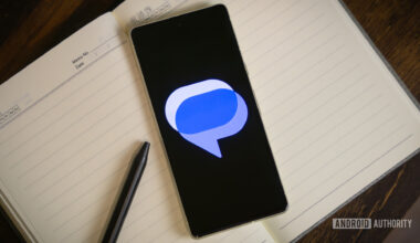 Google Messages logo on smartphone laying on table (4)