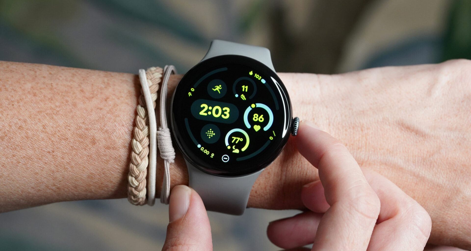 A 45mm Google Pixel Watch 3 on a user's wrist displays the watch face.