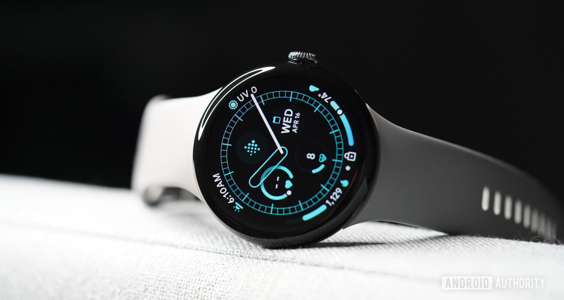 A Google Pixel Watch 3 displays a watch face.
