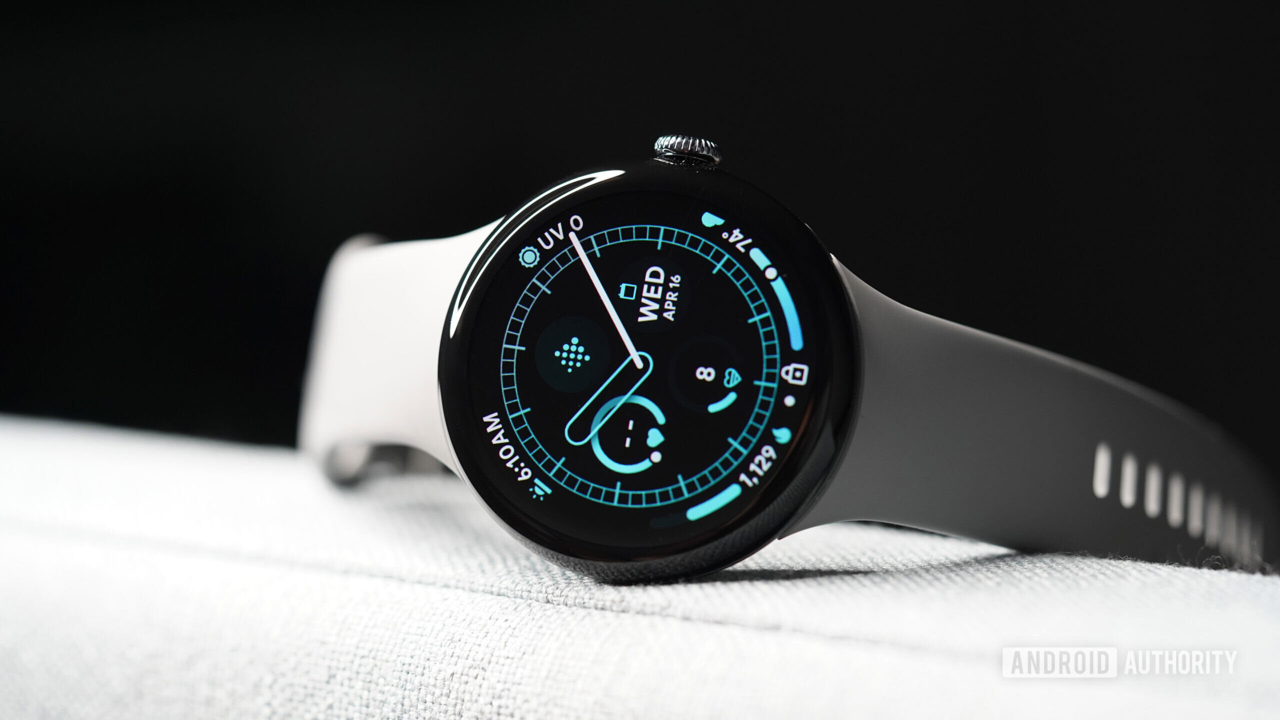 A Google Pixel Watch 3 displays a watch face.