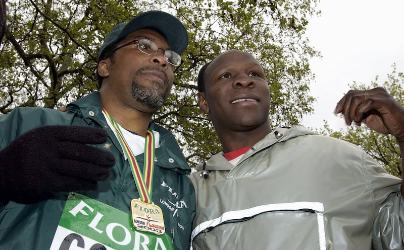 Michael Watson and Chris Eubank after Watson  crossed the finish line of the London Marathon in 2003. Photograph: Paul Gilham/Getty Images