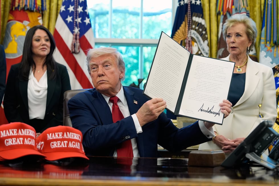 President Donald Trump holds a signed executive order relating to Historically Black Colleges...