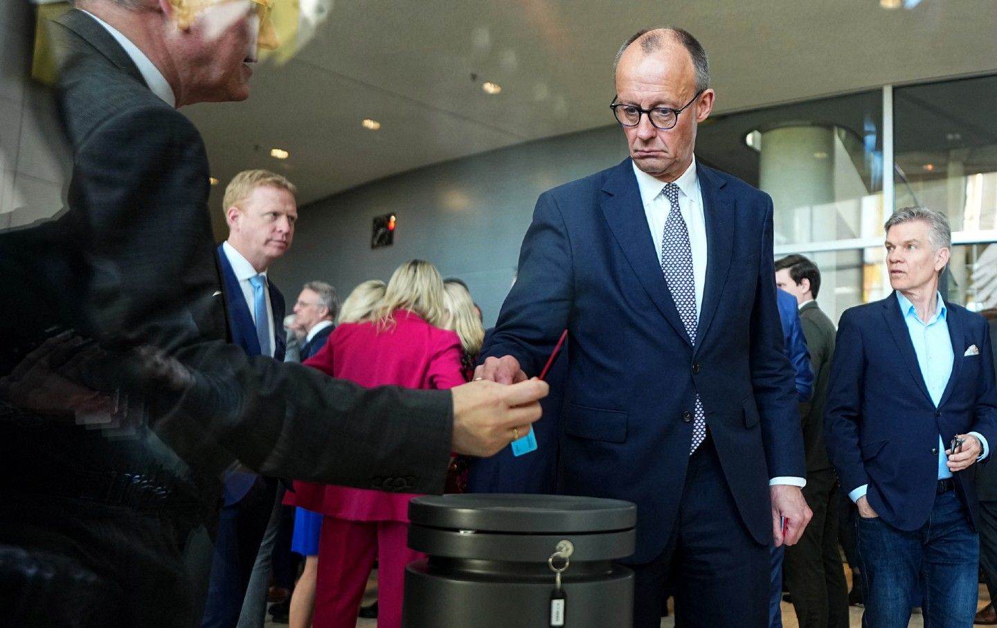 Chancellor designate and leader of the German Christian Democrats (CDU) Friedrich Merz casts his ballot on changes to Germany's Basic Law, loosening federal debt and defense spending limits, on March 18, 2025, in Berlin, Germany.