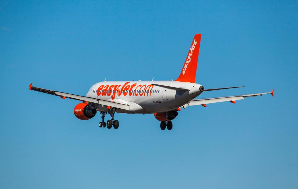 EasyJet Airbus A320-214 airplane in flight.
