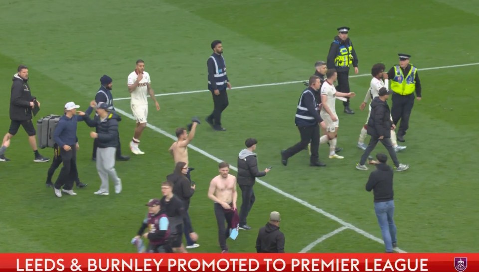Leeds and Burnley players and fans celebrating promotion to the Premier League.