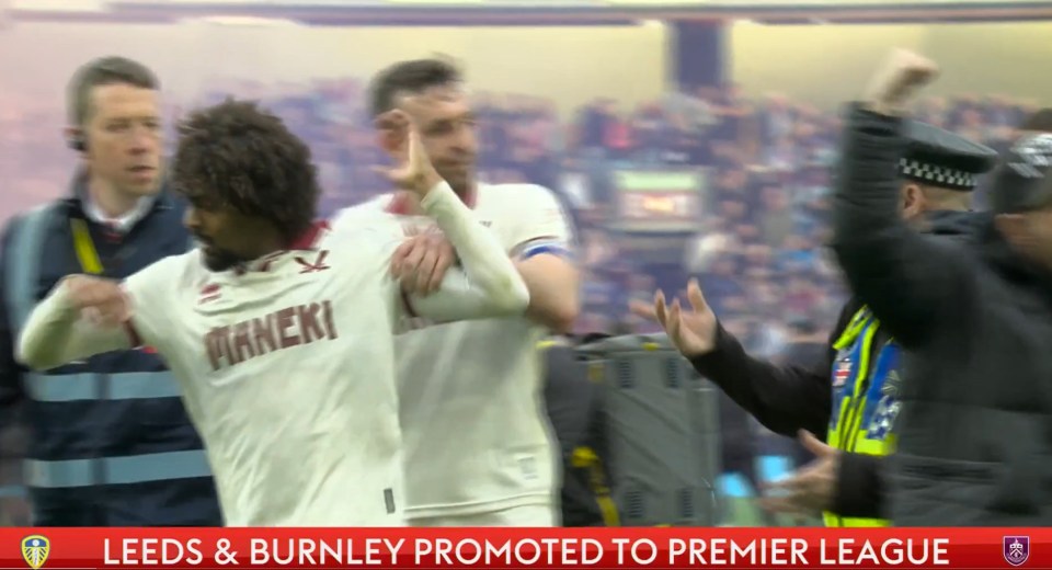 Burnley player celebrating promotion to the Premier League.