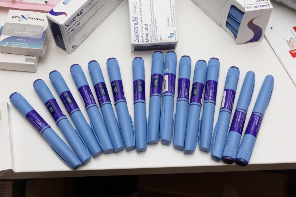 Photo of multiple GLP-1 medicine pens.
