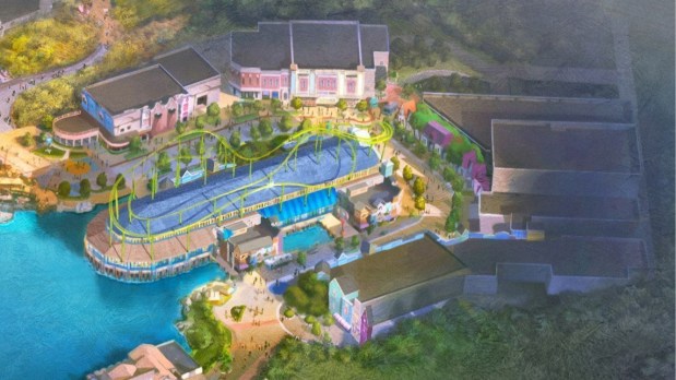 Concept art of a colorful themed land with a rooftop roller coaster at the Universal Studios Great Britain theme park opening in 2031 outside London. (Courtesy of Universal Studios)
